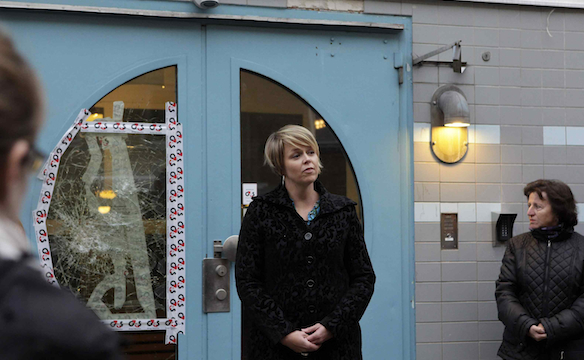 Malmo Councillor Katrin Stjernfeldt Jammeh stands in front of the gate of a Jewish Community Center in Malmo