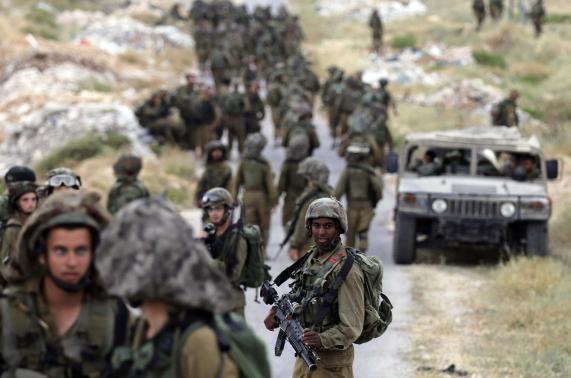 Israeli soldiers take part in operation to locate three Israeli teens near West Bank City of Hebron