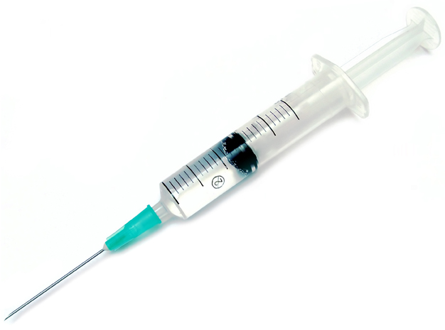 A syringe filled with some fluid isolated on white background