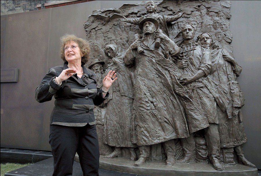 Wartime refugee Sonja Muhlberger, 75, stands in front of the statue of six Jewish people that was unveiled at the Shanghai Jewish Refugees Museum yesterday Wang Rongjiang shanghaidailycom