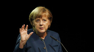 German Chancellor Merkel gestures as she gives a speech at German sustainable development congress in Berlin