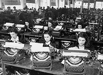 Group of young women working in a typewriter factory