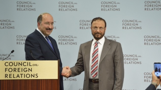 Dore Gold and Anwar Eshki shake hands in Washington DC, June 4, 2015 (Debby Communications Group)