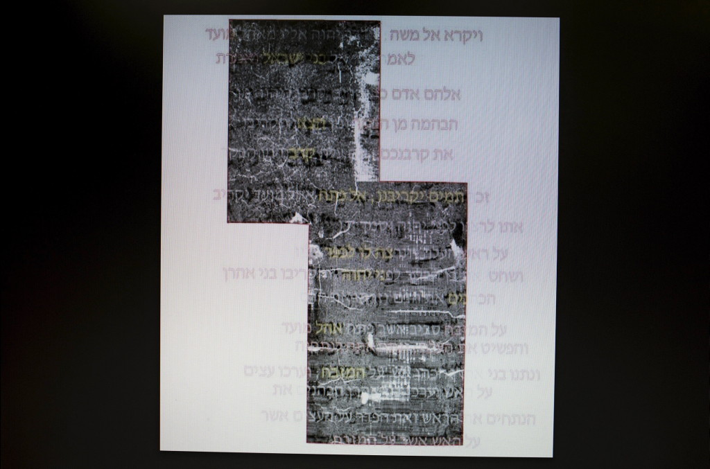 Writings, believed to be ancient Hebrew script from the bible, is displayed on a computer screen at the Israel Museum in Jerusalem July 20, 2015.  Israeli archaeologists said on Monday they had discerned the biblical writing on a 1,500 year old scroll they deemed the oldest biblical text found since the Dead Sea Scrolls. Using micro C-T scanning and virtual mapping techniques scientists last week discerned an ancient Hebrew script of what experts say are the first eight verses of the bible's old testament book of Leviticus, a curator at the Israel Antiquities Authority said. REUTERS/Amir Cohen