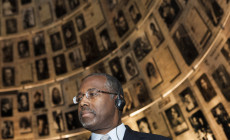 In this Thursday, Dec. 18, 2014 photo, Ben Carson visits Yad Vashem Holocaust memorial in Jerusalem. Carson, 63, a retired African-American neurosurgeon best known for his groundbreaking work in separating conjoined twins, has not yet declared his candidacy for the Republican Presidential nomination, saying that he is "strongly considering" a bid. (AP Photo/Dan Balilty)