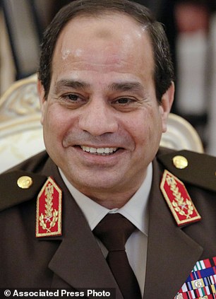 FILE - In this Thursday, Feb. 13, 2014 file photo, Egypts military chief Field Marshal Abdel-Fattah el-Sissi smiles as he speaks to Foreign Minister Sergey Lavrov during their talks along with Egyptian Foreign Minister Nabil Fahmy and Russian Defense Minister Sergei Shoigu in Moscow, Russia. Former military chief Abdel-Fattah el-Sissi, if he wins Egypts presidency as is widely expected, will have an overwhelming presence over a shattered political scene. Egypts once dominant political force, the Muslim Brotherhood, is exhausted under a relentless crackdown. Non-Islamist parties are weak and largely acquiescent to his power. But the political vacuum is hardly a stable one. The Brotherhood is betting that with time the public will turn against el-Sissi. (AP Photo/Alexander Zemlianichenko, File)