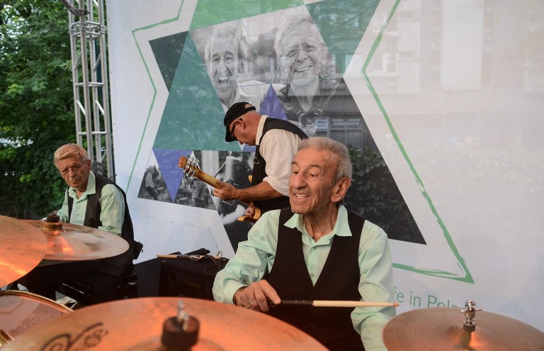 Saul Dreier (R) and Reuwen 'Ruby' Sosnowicz (L) from the Holocaust Survivors Band during a rehearsal before a concert in Warsaw, Poland, on July 26, 2016. The Holocaust Survivors Band members are two Polish Jews who survived the Holocaust. They will perform in a special concert with Polish musician Muniek Staszczyk and Warsaw Orchestra Sentimentale. Saul Dreier and Reuwen 'Ruby' Sosnowicz visit Poland for the first time since the Second World War. / AFP PHOTO / PAP / JAKUB KAMINSKI